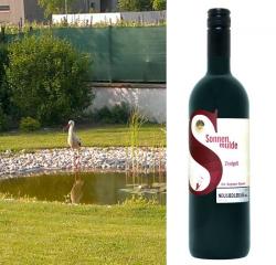 White Stork at the pond and a bottle of Neusiedlersee DAC